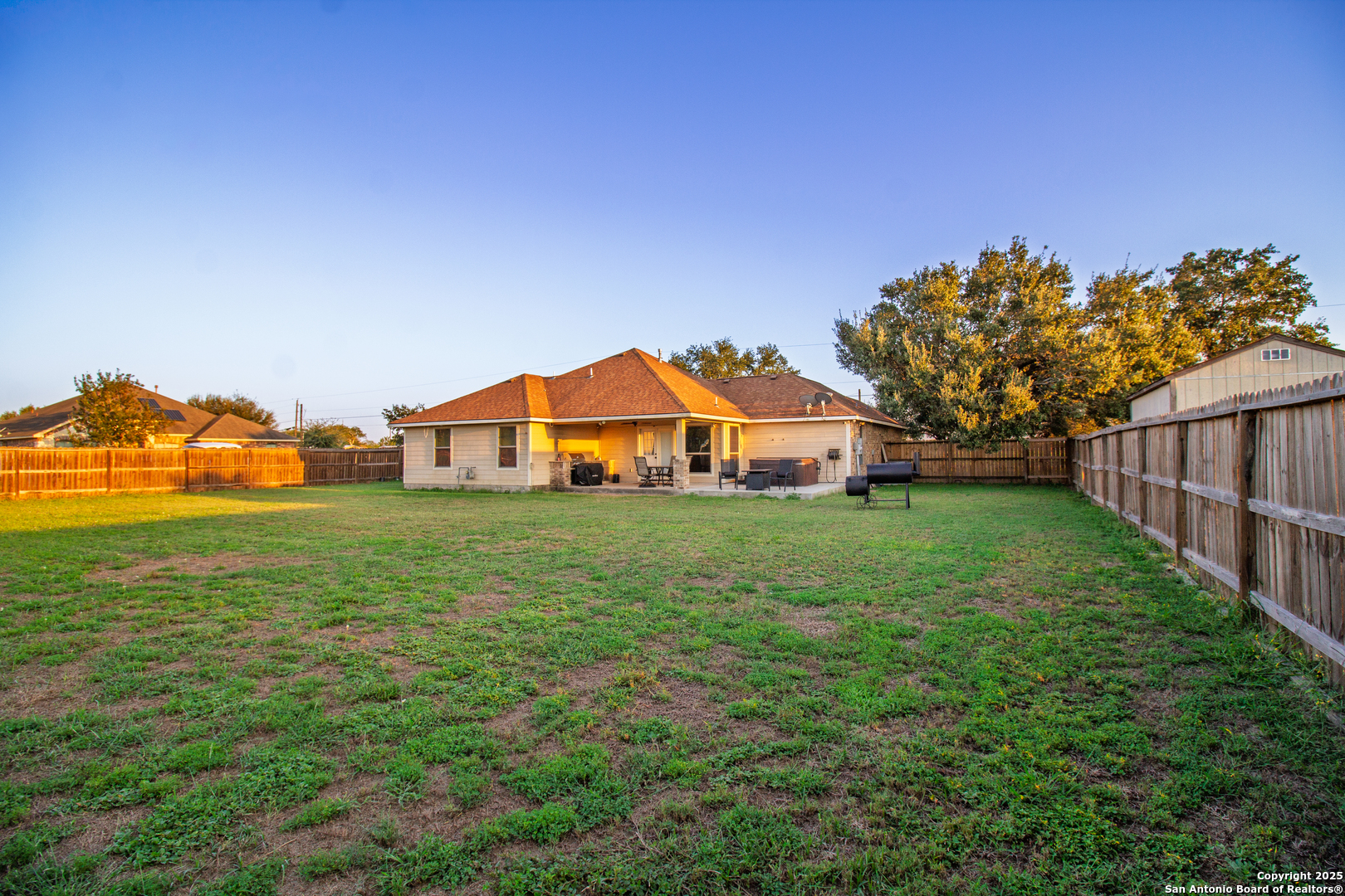 504 West Sullivan Street Skidmore, TX 78389 - Photo 32 of 35 a view of a green field with house in the background