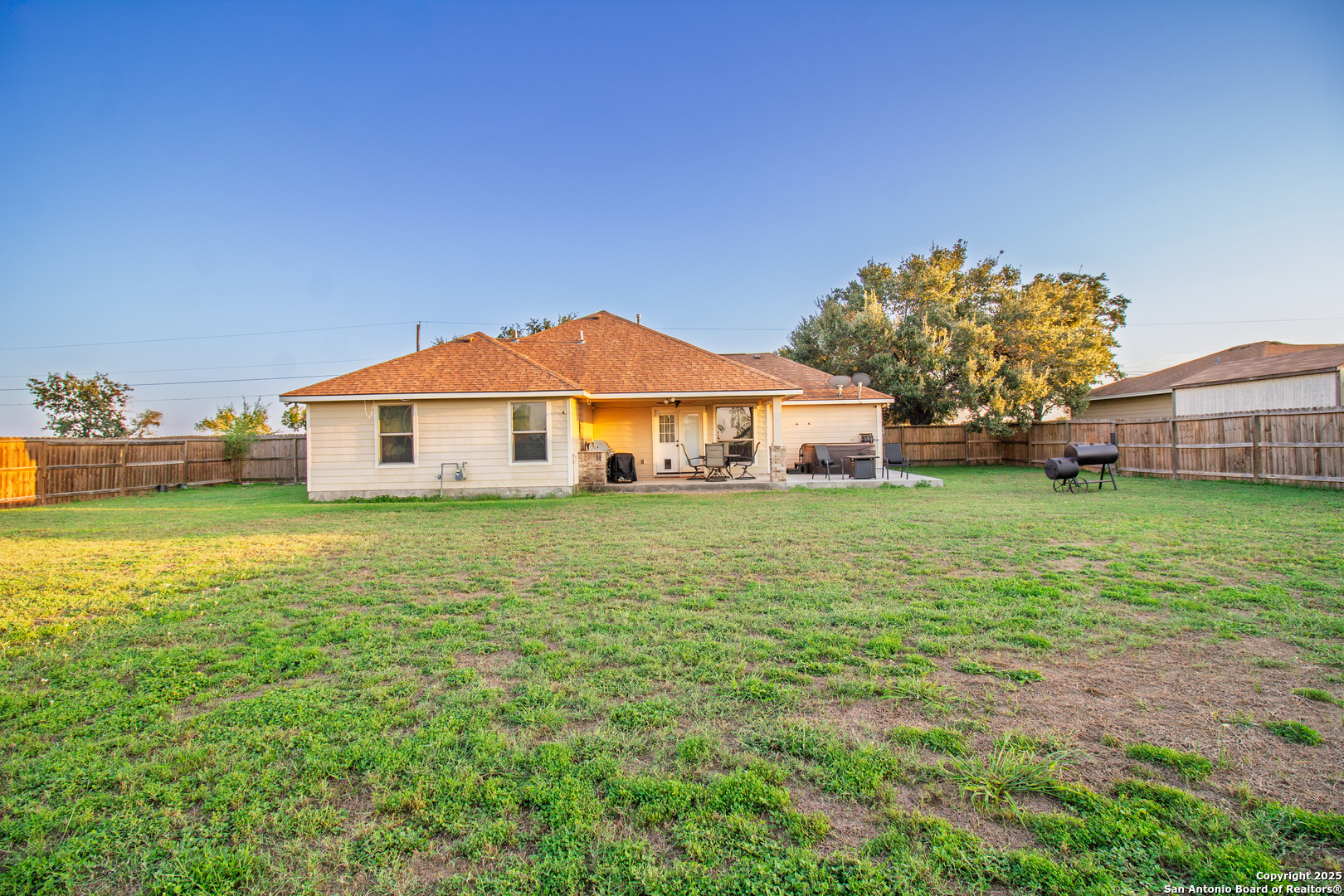 504 West Sullivan Street Skidmore, TX 78389 - Photo 33 of 35 a front view of a house with garden