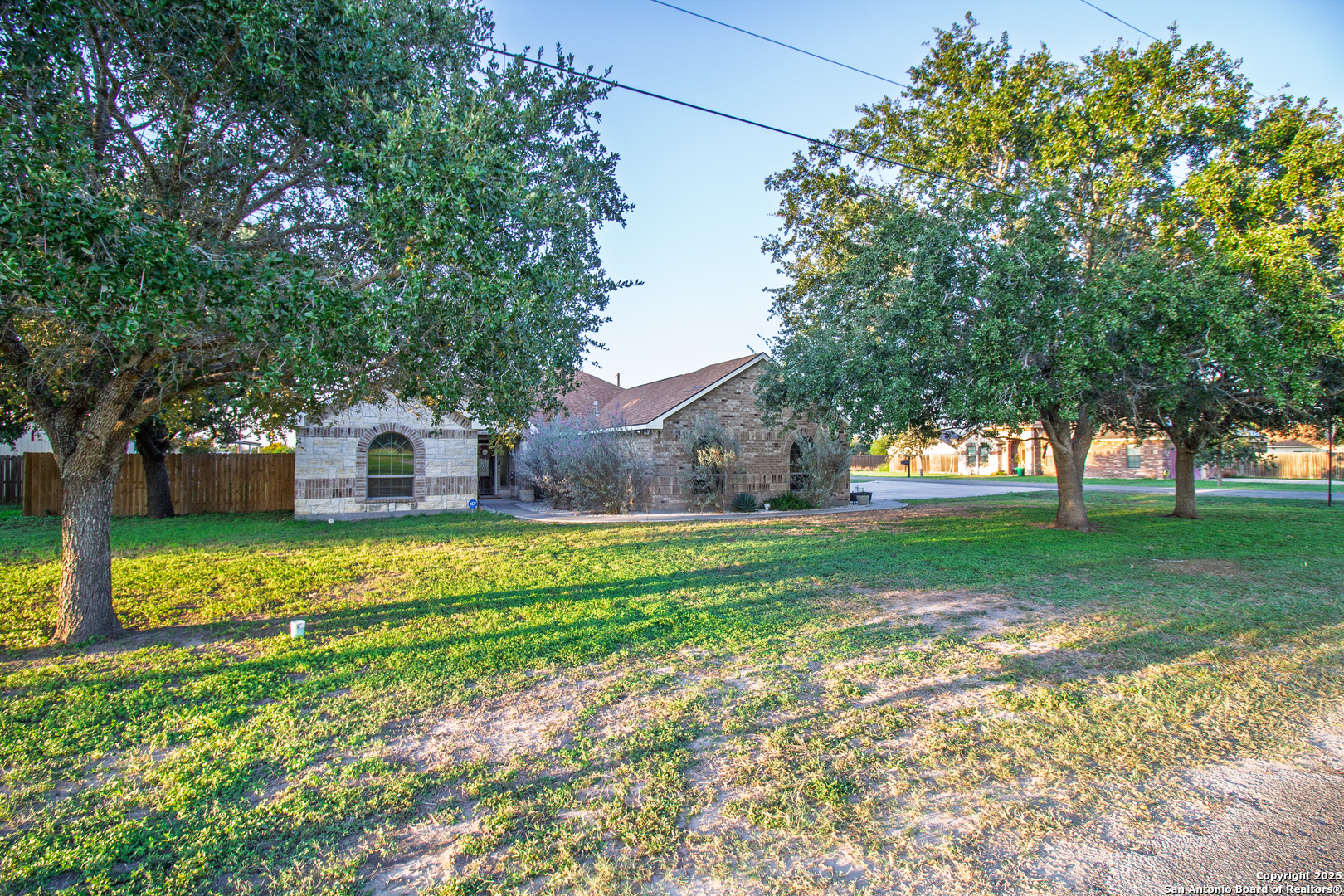 504 West Sullivan Street Skidmore, TX 78389 - Photo 4 of 35 a front view of a house with a yard
