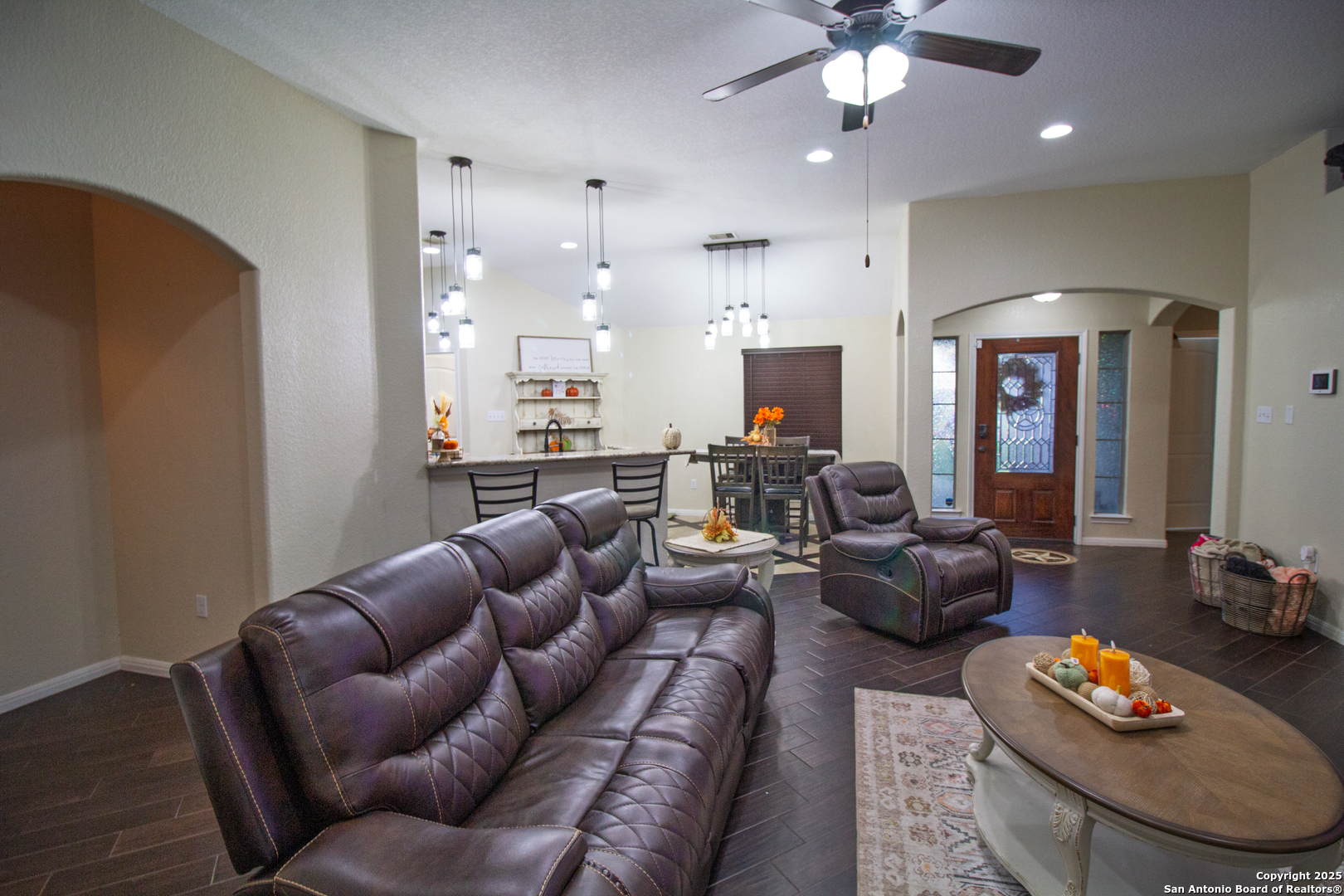 504 West Sullivan Street Skidmore, TX 78389 - Photo 7 of 35 a living room with furniture kitchen and a chandelier