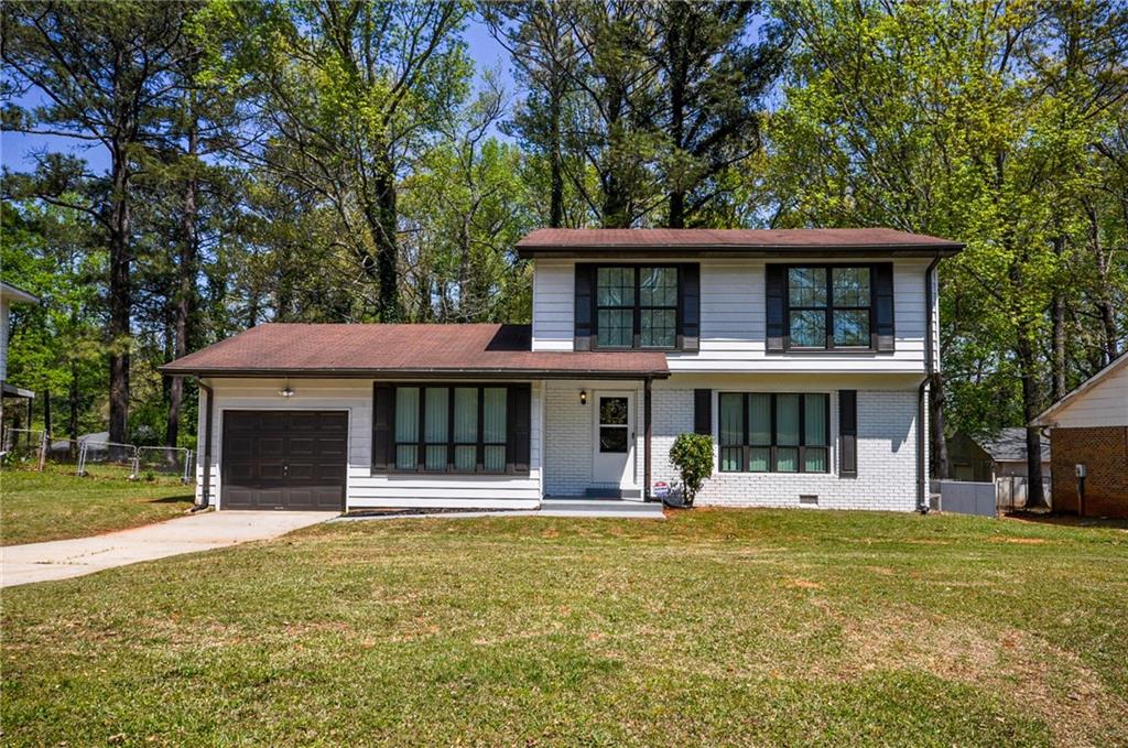 1620 Pintail Road Jonesboro, GA 30238 - Photo 1 of 1 a front view of a house with swimming pool