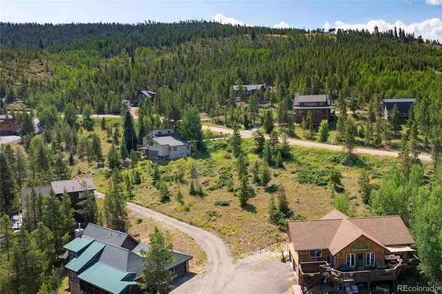 a view of a chairs and table in patio