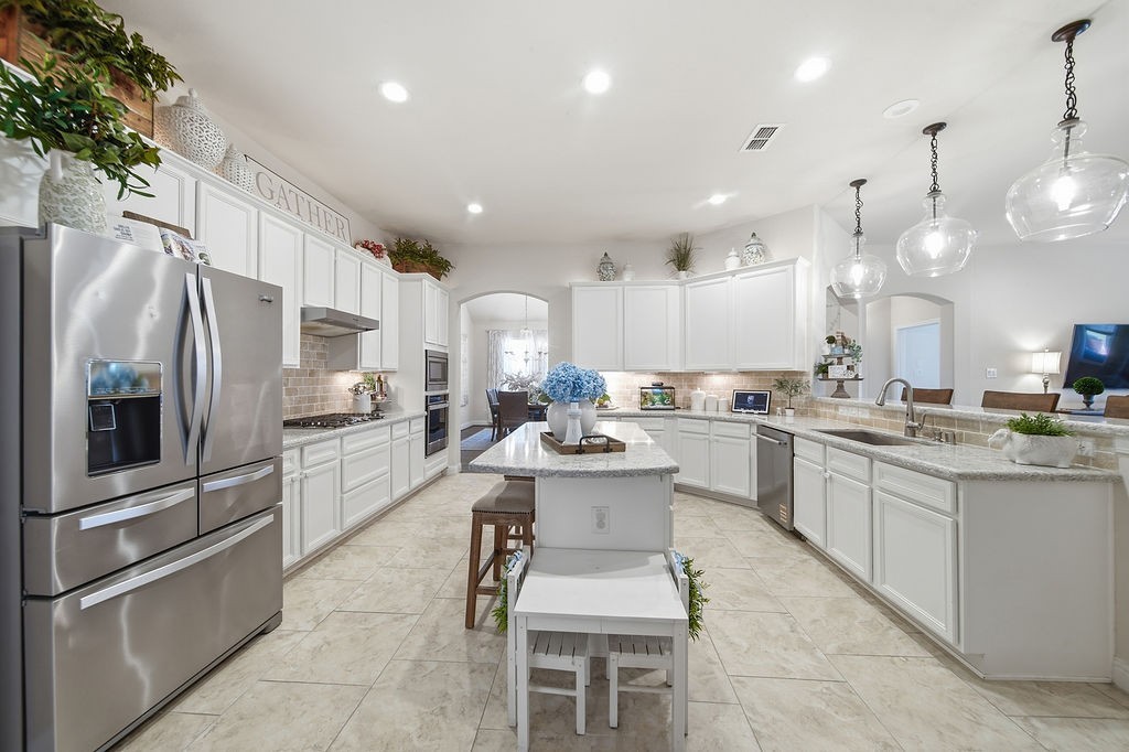 9614 Carson Lane Iowa Colony, TX 77583 - Photo 14 of 50 Absolutely love having TWO areas where you can pull up barstools and hang out with friends and family!