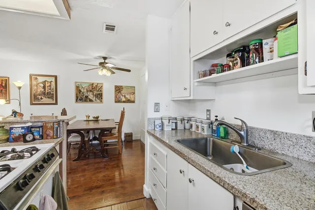 a bedroom with a bed and a desk