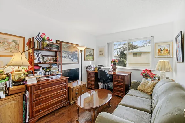 a living room with furniture a computer and work place