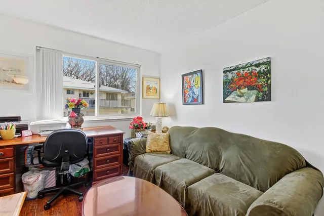 a front view of a house with sitting area