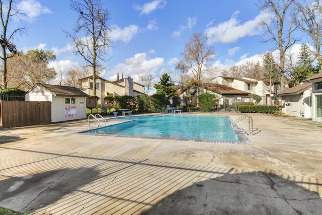 a view of a backyard with a garden and plants