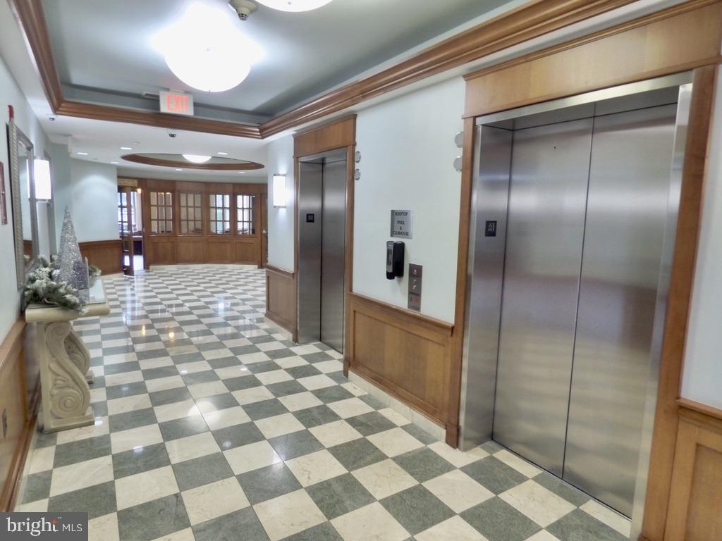 11800 Sunset Hills Road, Unit 118 Reston, VA 20190 - Photo 32 of 52 Elegant corridor with dual elevators.