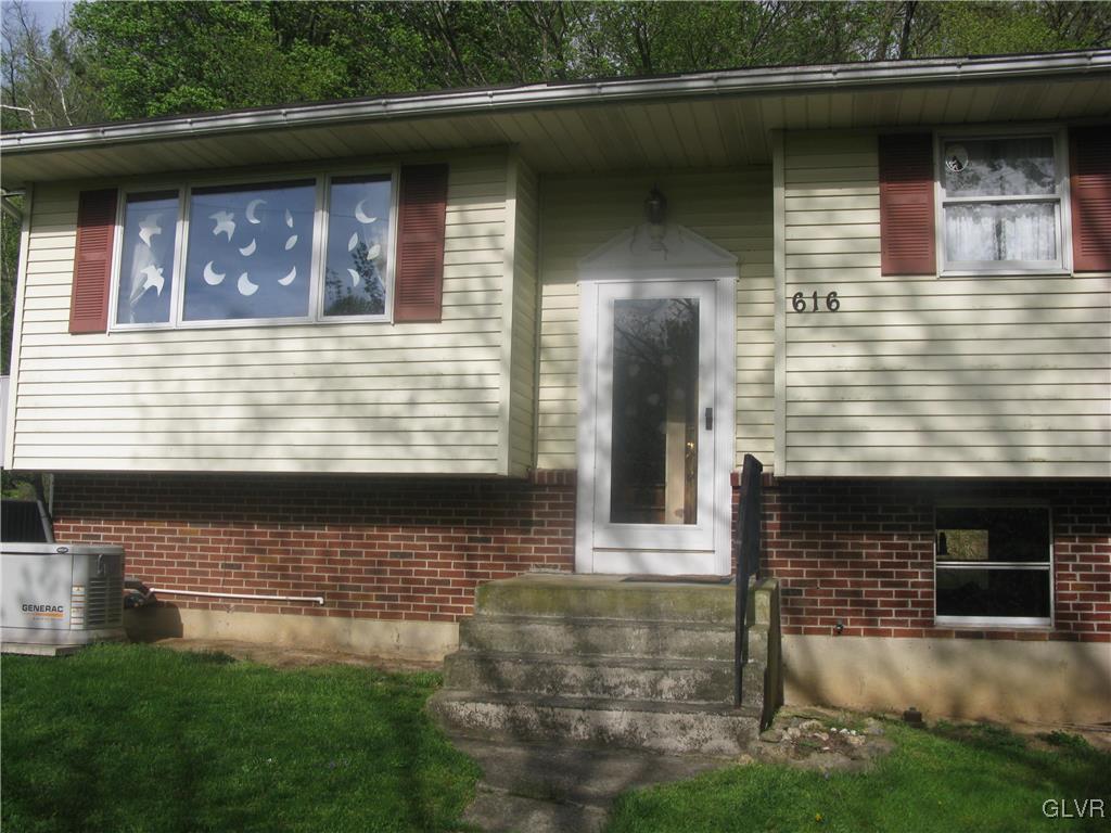 616 South Summit Road Bath, PA 18014 - Photo 1 of 22 a front view of a house with garage