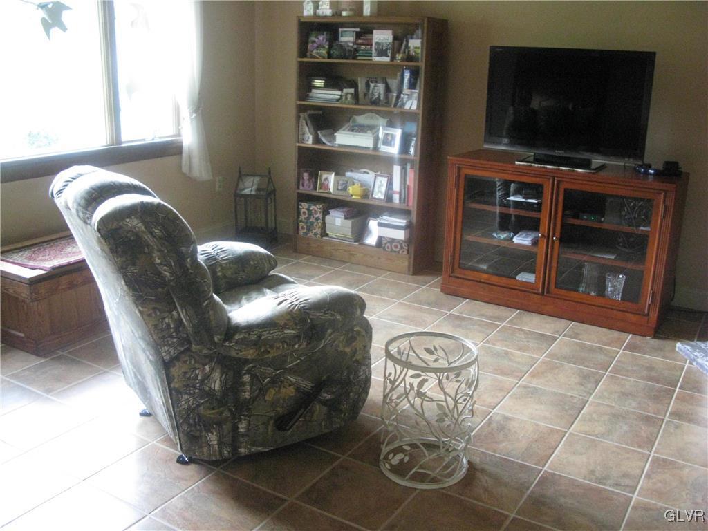 616 South Summit Road Bath, PA 18014 - Photo 16 of 22 a living room with furniture and a flat screen tv