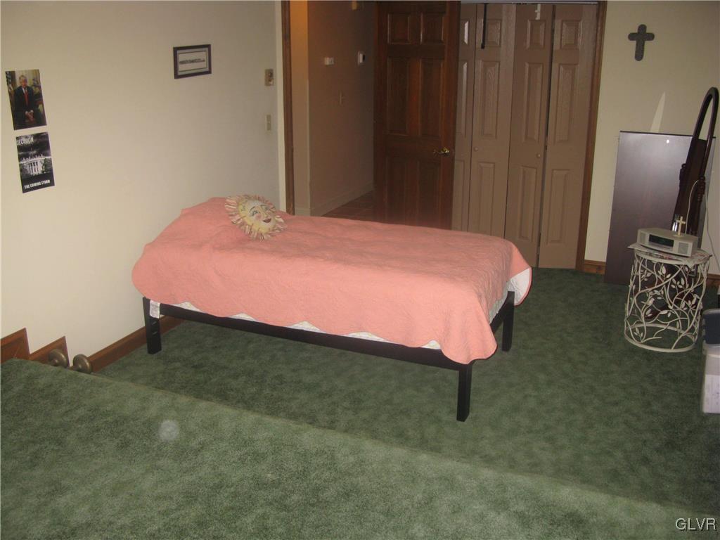 616 South Summit Road Bath, PA 18014 - Photo 20 of 22 a bed room with a bed and a television