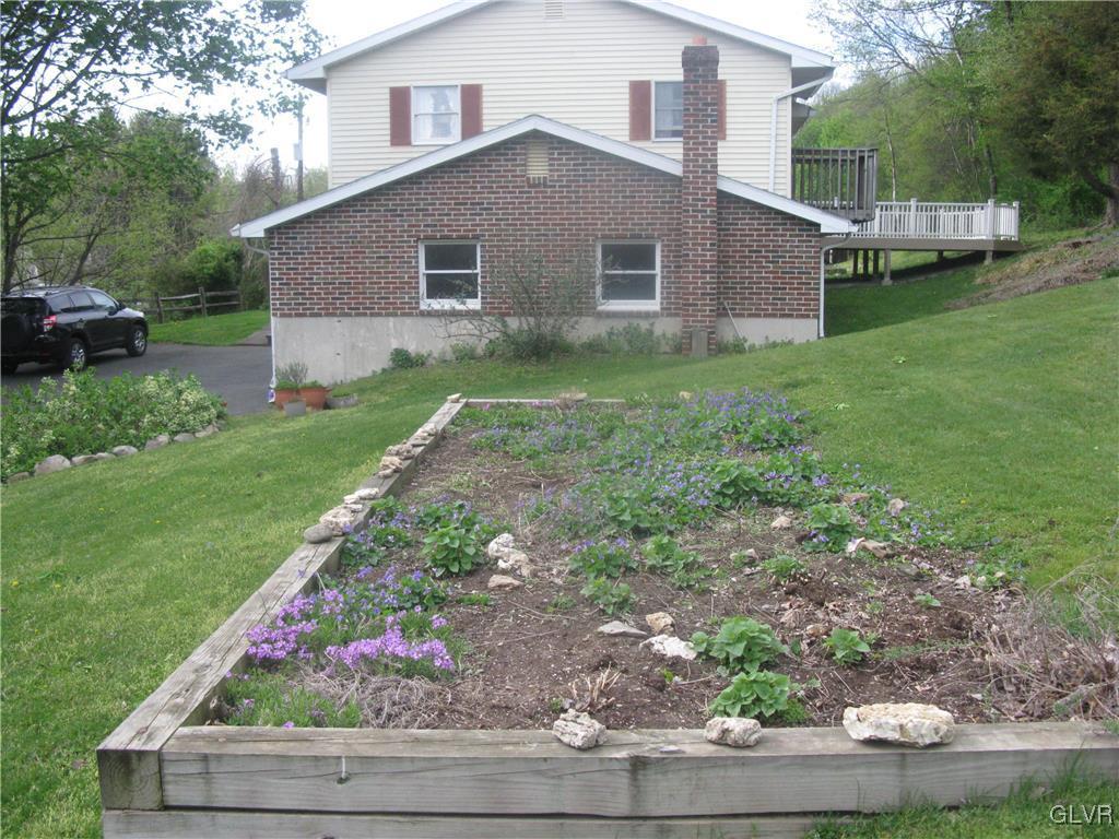 616 South Summit Road Bath, PA 18014 - Photo 5 of 22 a front view of house with yard and green space
