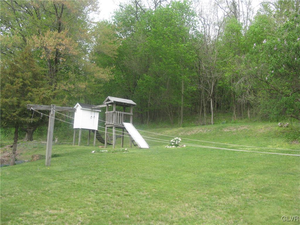 616 South Summit Road Bath, PA 18014 - Photo 8 of 22 a garden view with a lake view