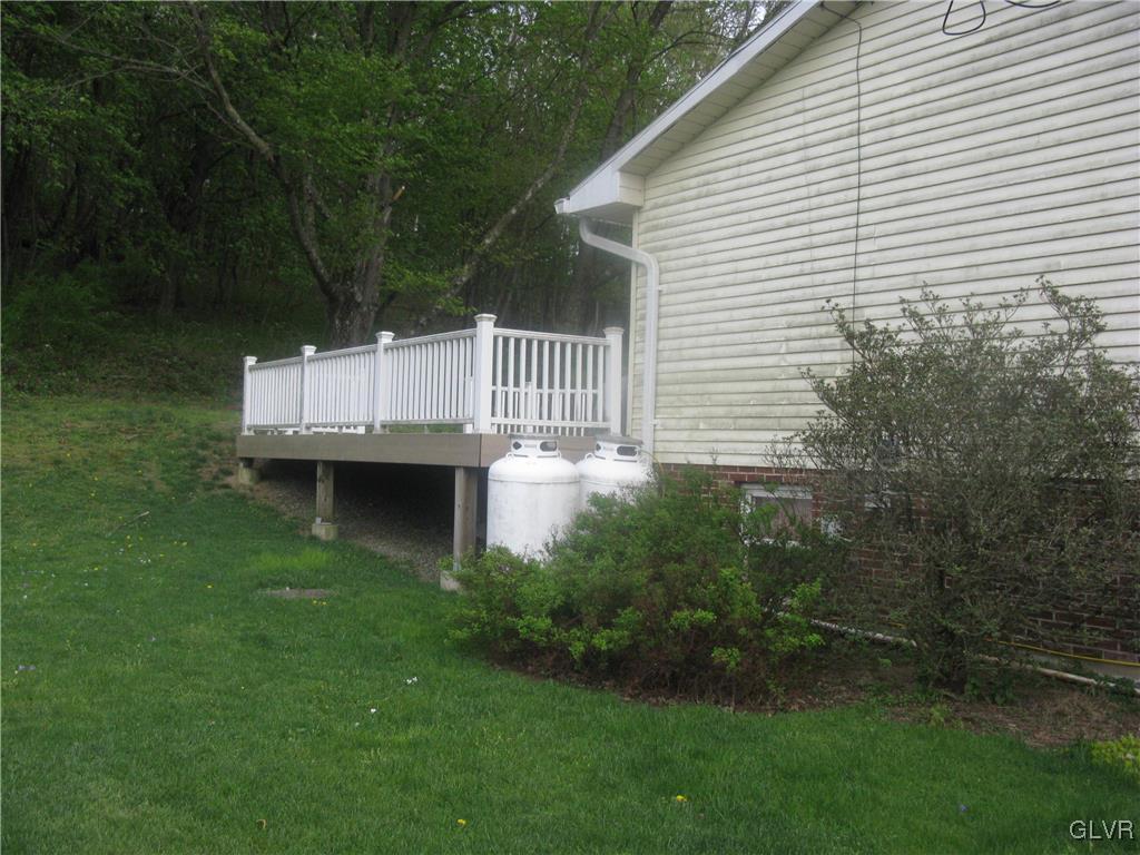 616 South Summit Road Bath, PA 18014 - Photo 10 of 22 a view of a house with a backyard and a chair