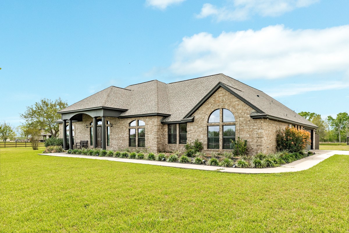 20111 Farm To Market Road 523 Angleton, TX 77515 - Photo 13 of 47 a front view of a house with a yard