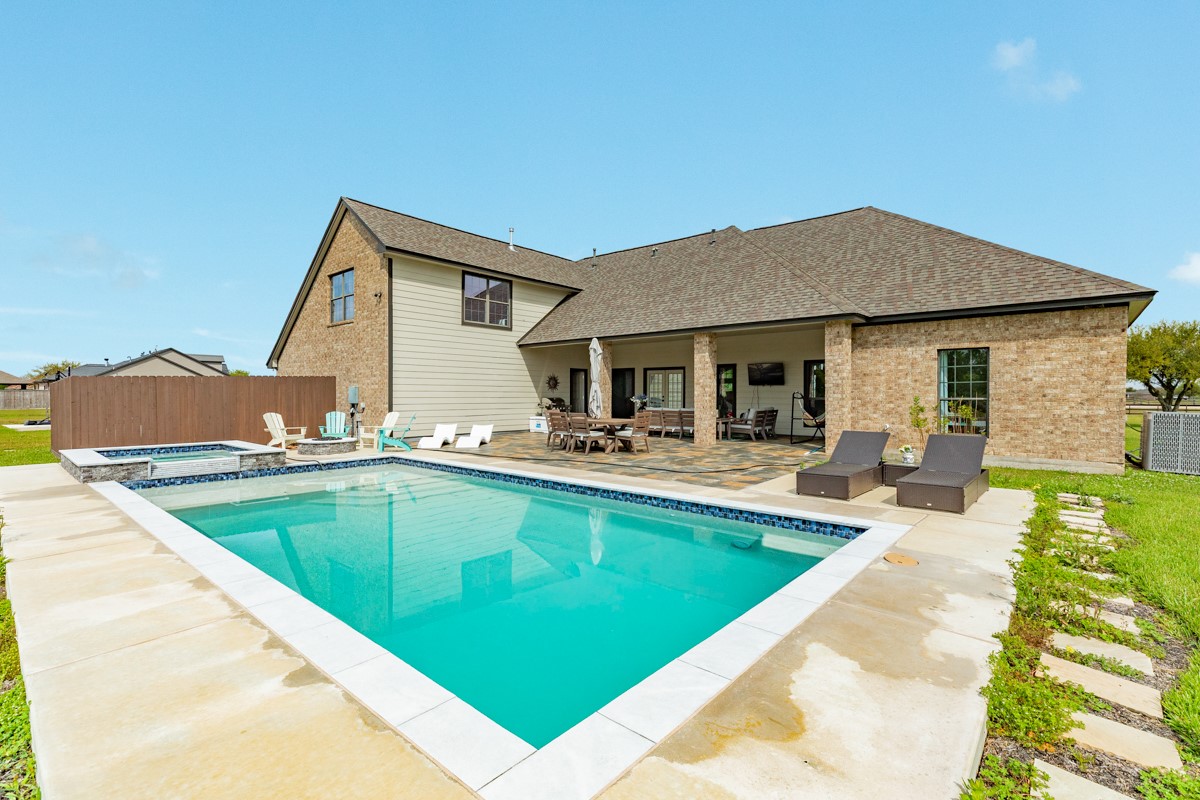 20111 Farm To Market Road 523 Angleton, TX 77515 - Photo 18 of 47 a view of a house with pool and chairs