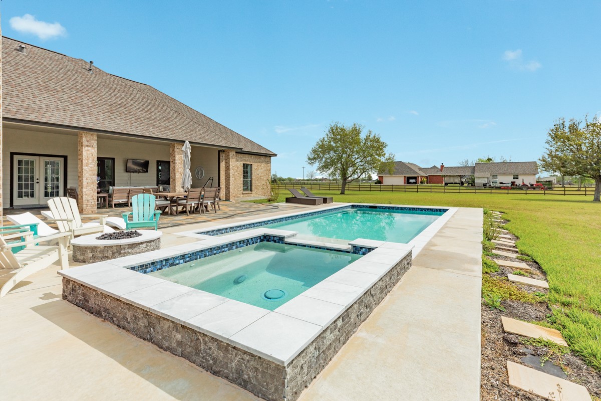 20111 Farm To Market Road 523 Angleton, TX 77515 - Photo 19 of 47 a view of a house with swimming pool and sitting area