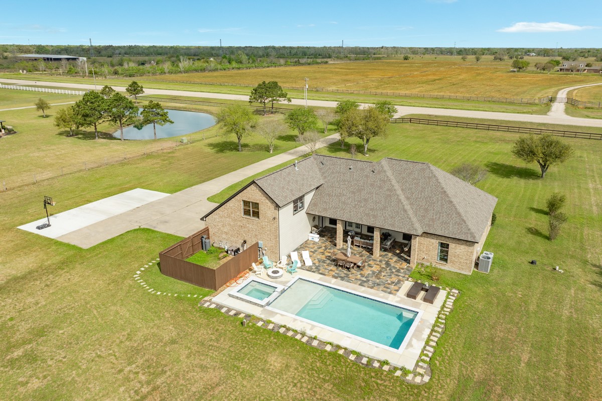 20111 Farm To Market Road 523 Angleton, TX 77515 - Photo 2 of 47 a view of a swimming pool with an ocean view