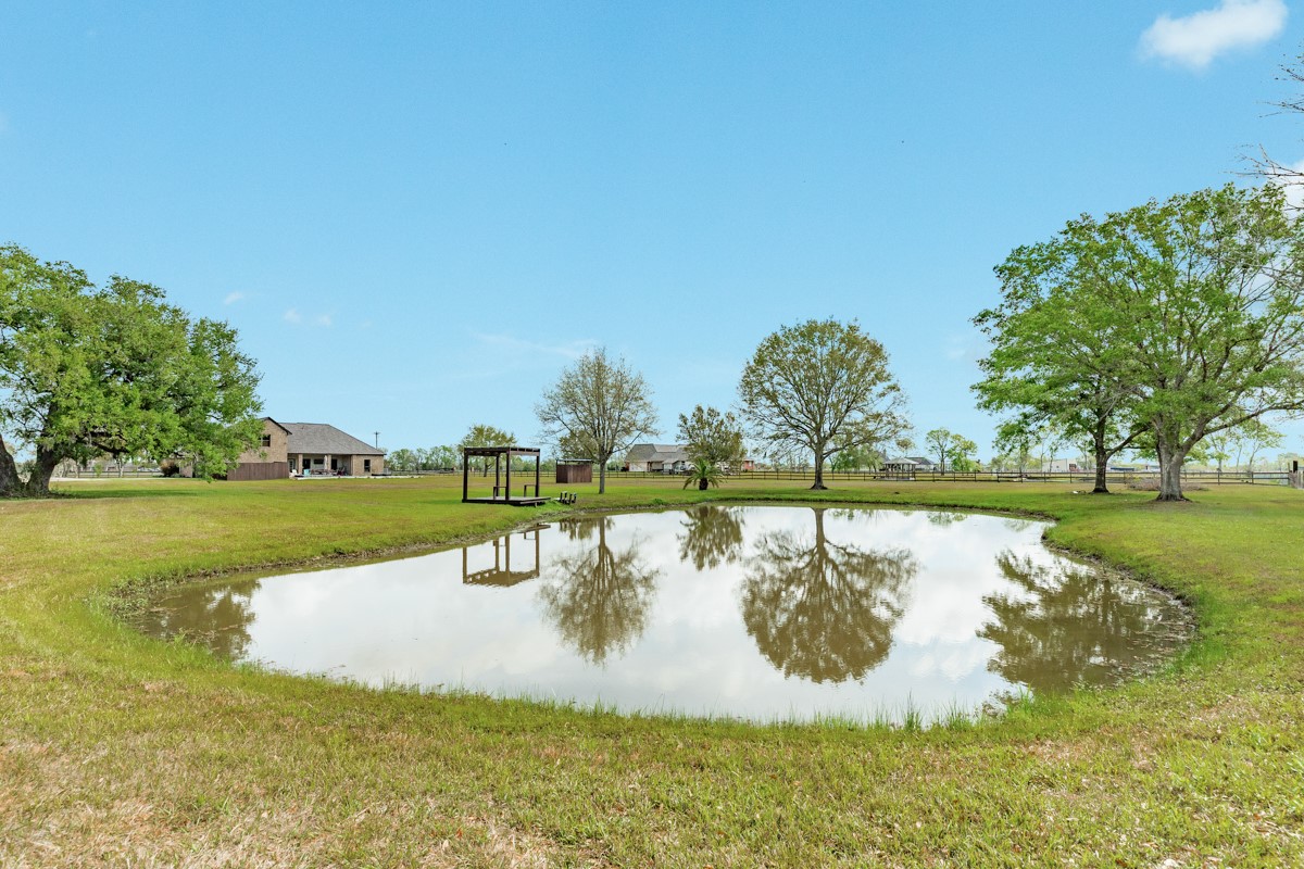 20111 Farm To Market Road 523 Angleton, TX 77515 - Photo 25 of 47 a swimming pool with trees in the background