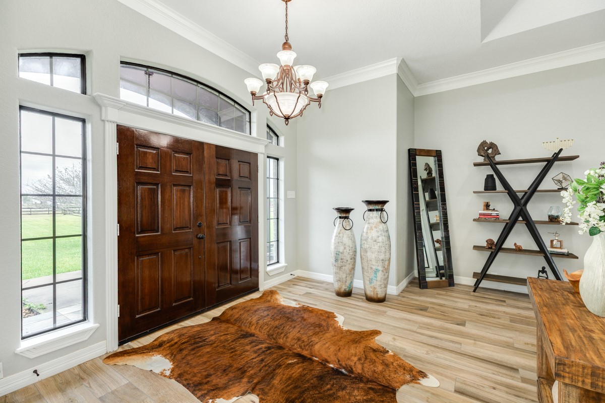 20111 Farm To Market Road 523 Angleton, TX 77515 - Photo 26 of 47 a view of a livingroom with a chandelier