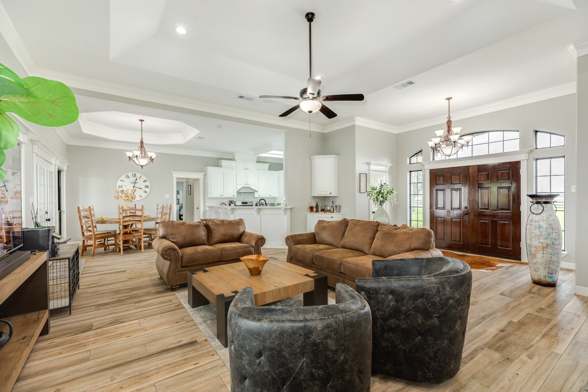 20111 Farm To Market Road 523 Angleton, TX 77515 - Photo 28 of 47 a living room with furniture and a chandelier