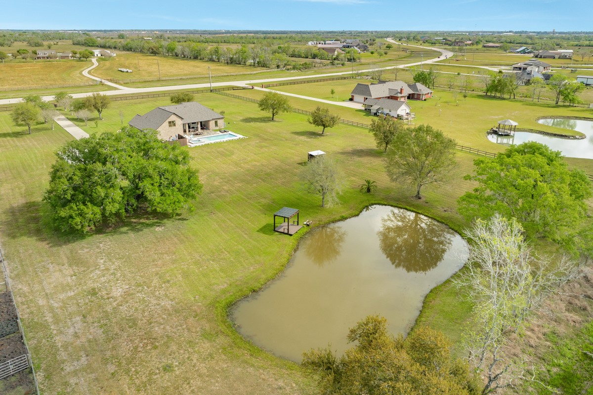 20111 Farm To Market Road 523 Angleton, TX 77515 - Photo 3 of 47 a view of a lake with a beach