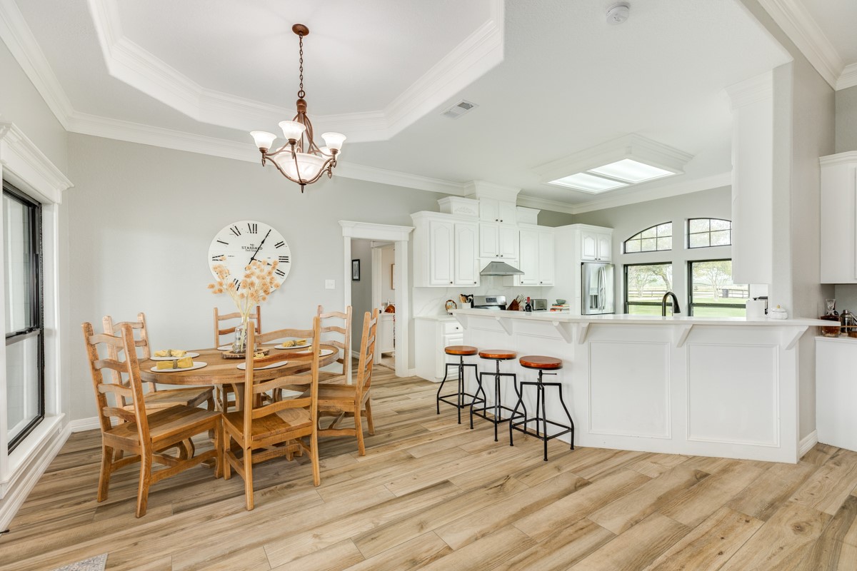 20111 Farm To Market Road 523 Angleton, TX 77515 - Photo 31 of 47 a view of a dining room with furniture and wooden floor