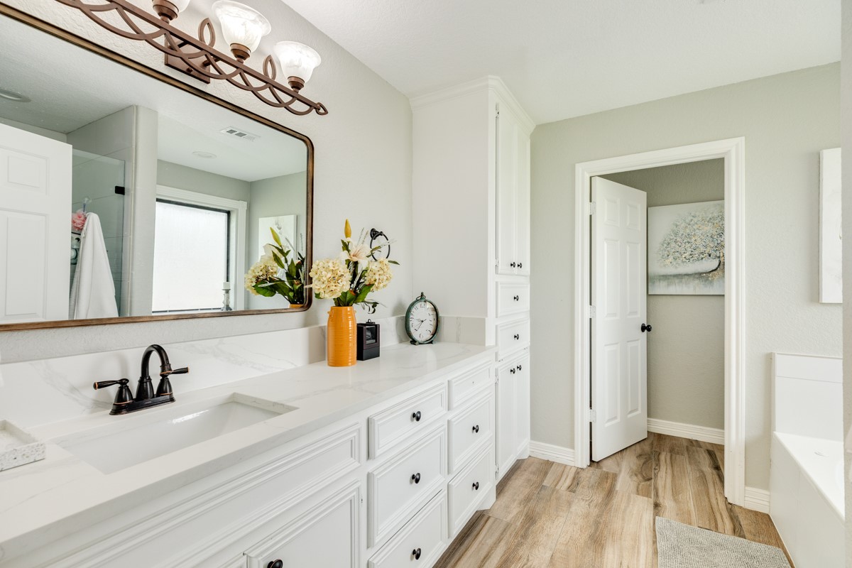 20111 Farm To Market Road 523 Angleton, TX 77515 - Photo 39 of 47 a bathroom with a double vanity sink
