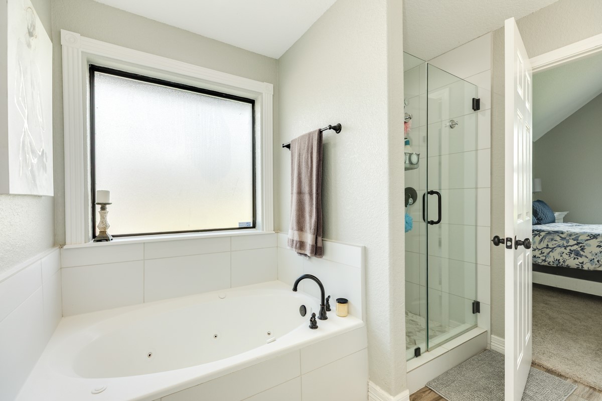 20111 Farm To Market Road 523 Angleton, TX 77515 - Photo 40 of 47 a bathroom with a bathtub and a shower