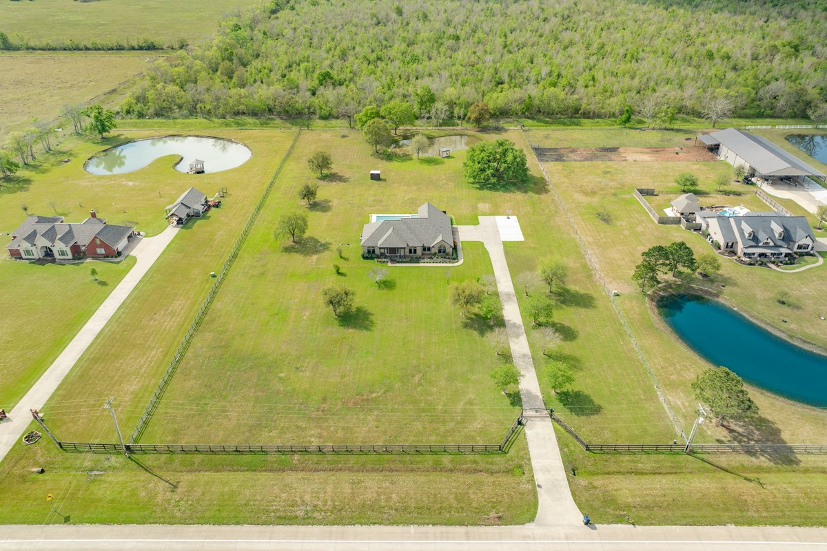 20111 Farm To Market Road 523 Angleton, TX 77515 - Photo 4 of 47 an aerial view of residential houses with outdoor space