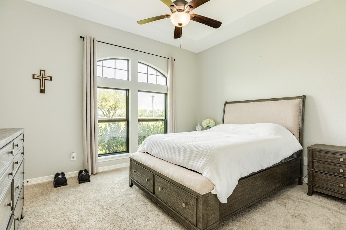 20111 Farm To Market Road 523 Angleton, TX 77515 - Photo 41 of 47 a bed sitting in a bedroom next to a window
