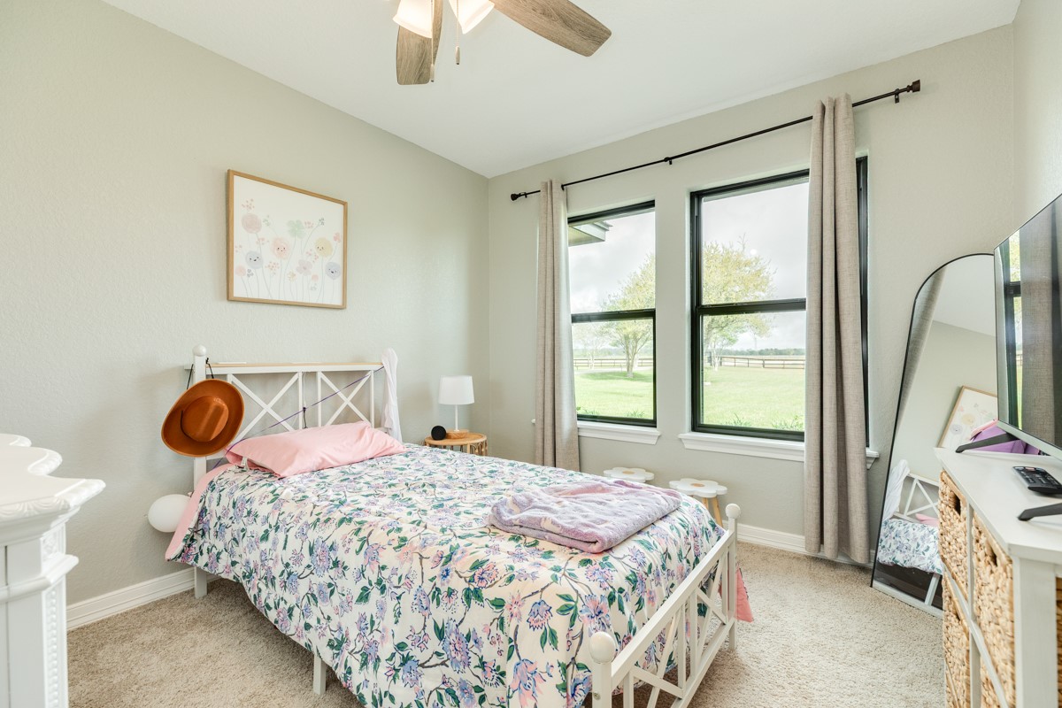 20111 Farm To Market Road 523 Angleton, TX 77515 - Photo 42 of 47 a bedroom with a bed and a window