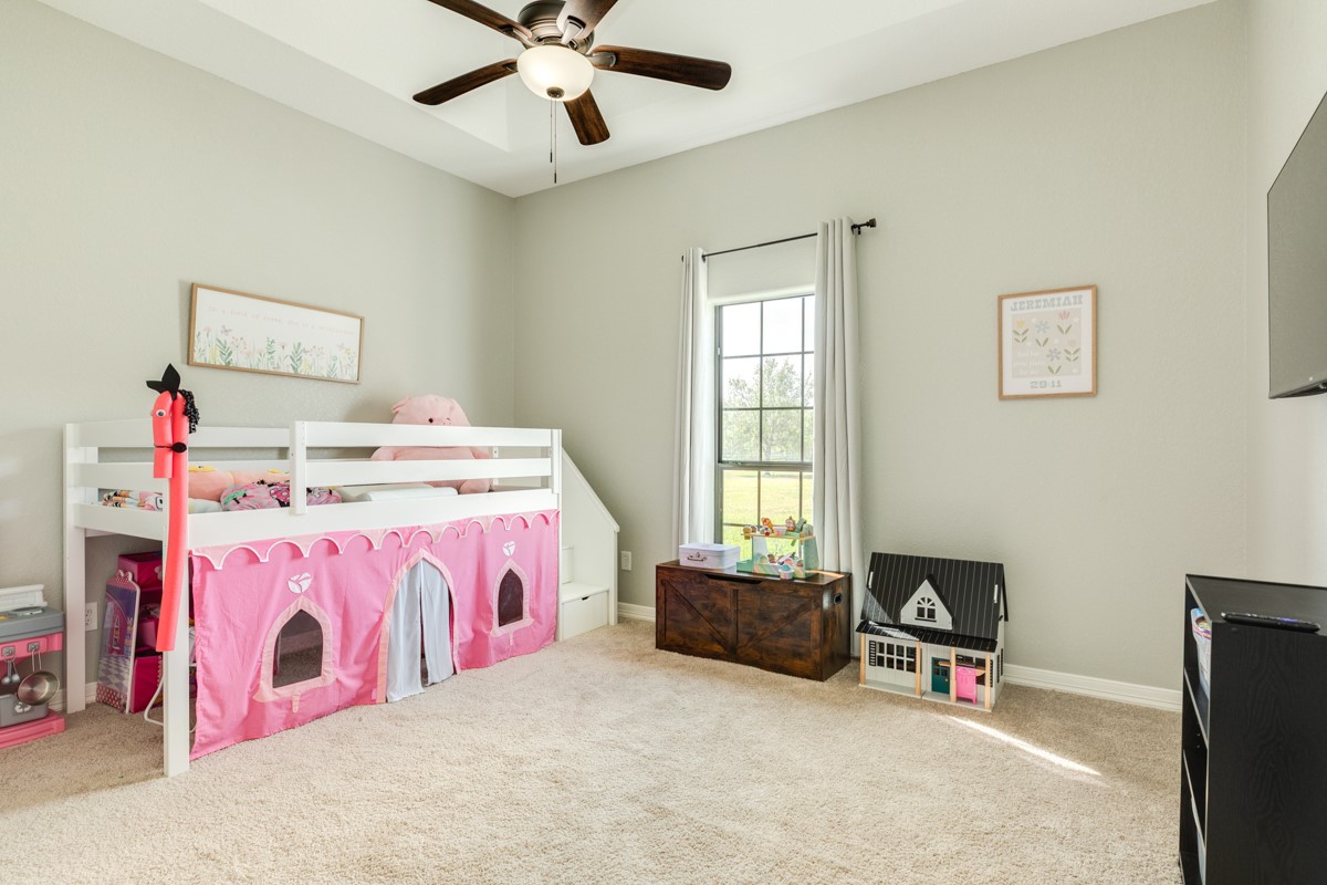 20111 Farm To Market Road 523 Angleton, TX 77515 - Photo 43 of 47 a bedroom with a bed dresser and a window