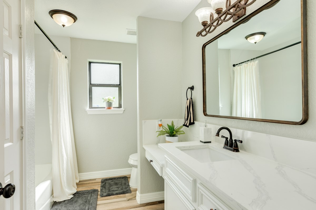 20111 Farm To Market Road 523 Angleton, TX 77515 - Photo 44 of 47 a bathroom with a sink and a mirror