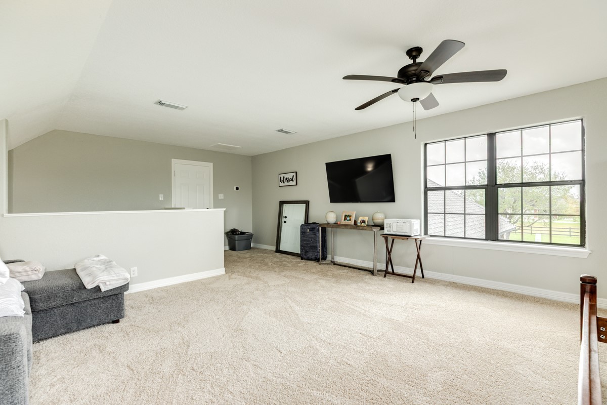 20111 Farm To Market Road 523 Angleton, TX 77515 - Photo 47 of 47 a living room with furniture and a flat screen tv