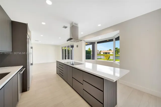a large bathroom with a sink and a large mirror