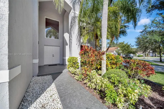 a view of entryway with flower pots