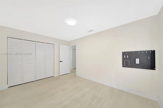 a bathroom with a double vanity sink mirror double shower and a toilet