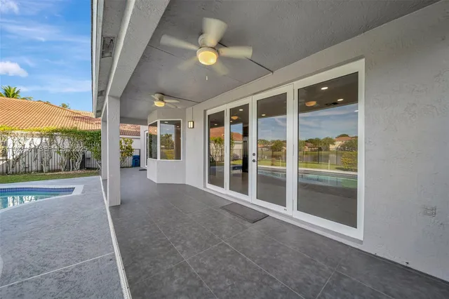 a view of a swimming pool with a lounge chair