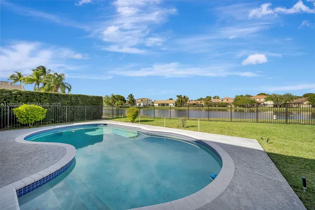 a view of a swimming pool with a lounge chair