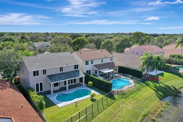 a aerial view of a house with a big yard