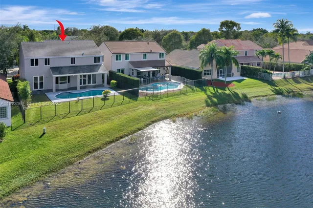 an aerial view of a city with lake view