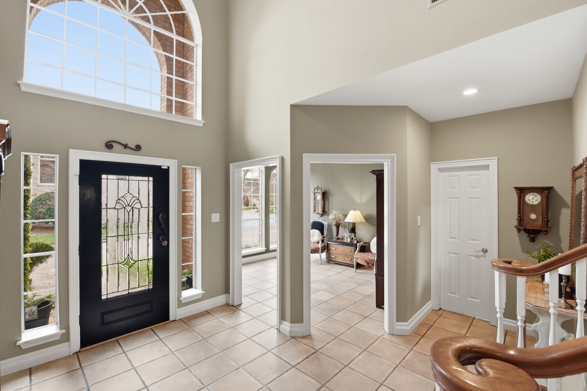 16322 Cranwood Drive Spring, TX 77379 - Photo 6 of 42 Step into the inviting foyer where a cozy den or home office awaits on the left, an elegant dining room beckons on the right, and a graceful staircase ascends ahead, offering a perfect blend of functionality and style.