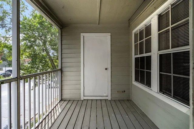 a view of balcony with wooden floor