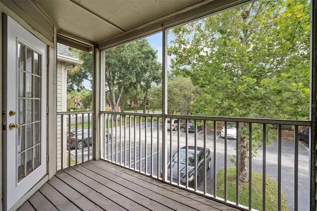 a view of a balcony with wooden floor