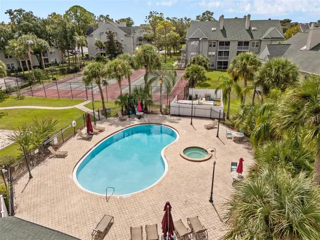 a view of a swimming pool with a patio