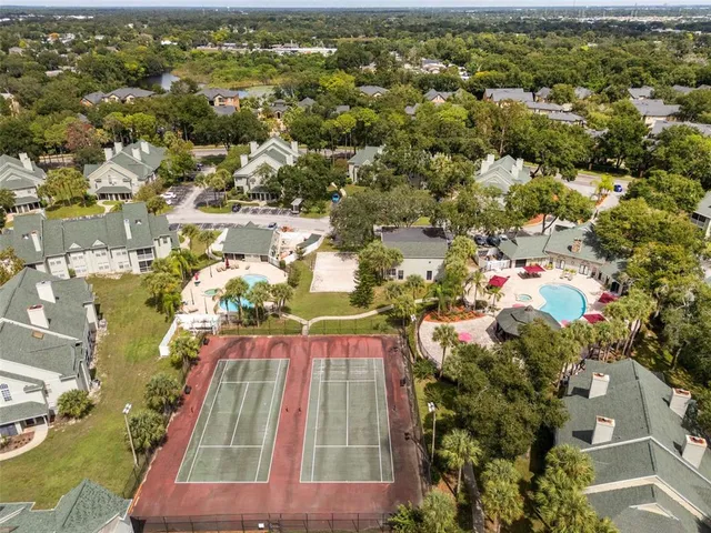 an aerial view of residential houses with outdoor space