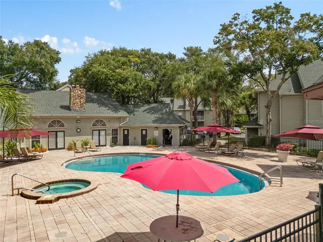 a swimming pool with outdoor seating