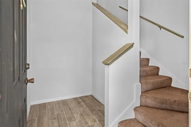 a view of livingroom with furniture and stairs