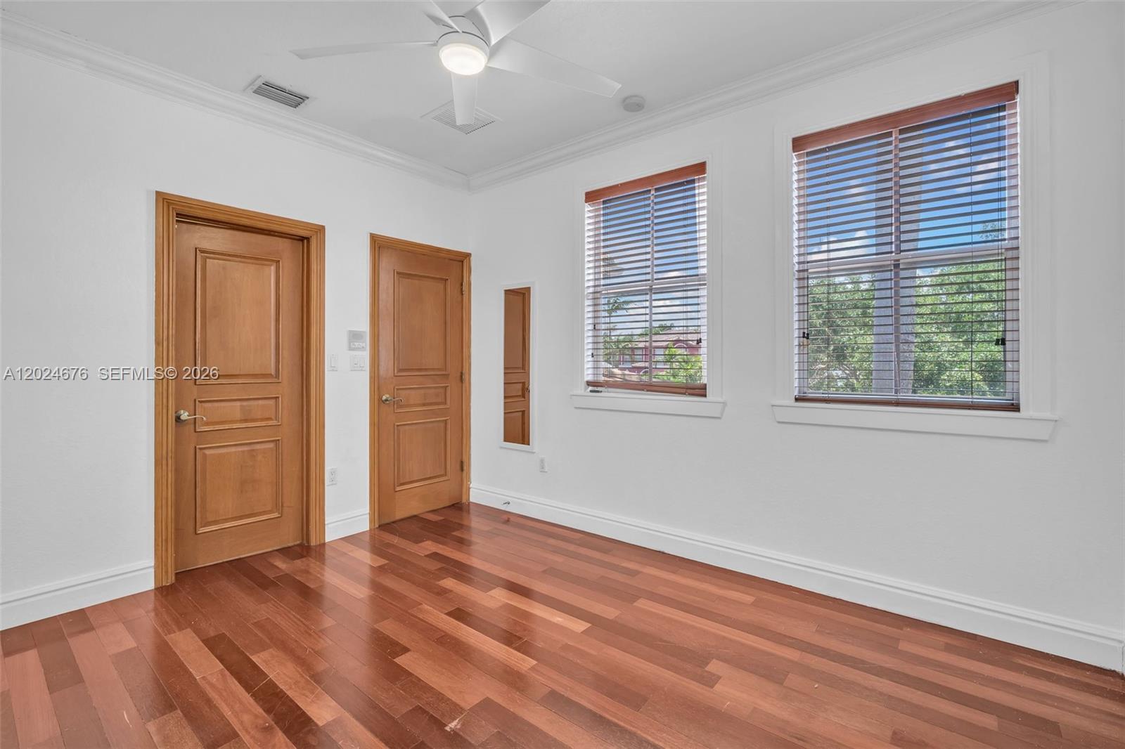 2155 Southwest 156th Court Miami, FL 33185 - Photo 37 of 57 a view of empty room with wooden floor and fan